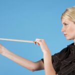 a student sets an object attached to a spring